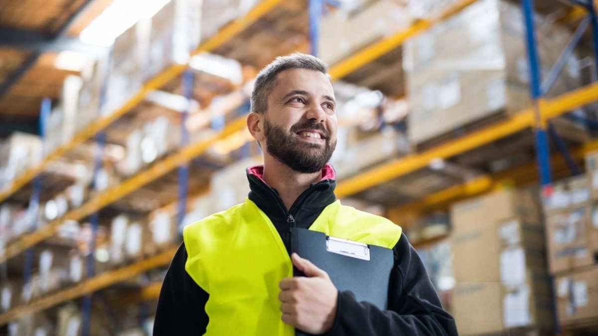 Man surveying a commercial warehouse for air con installation