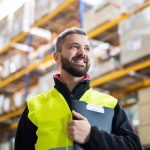 Man surveying a commercial warehouse for air con installation