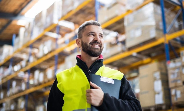 Man surveying a commercial warehouse for air con installation