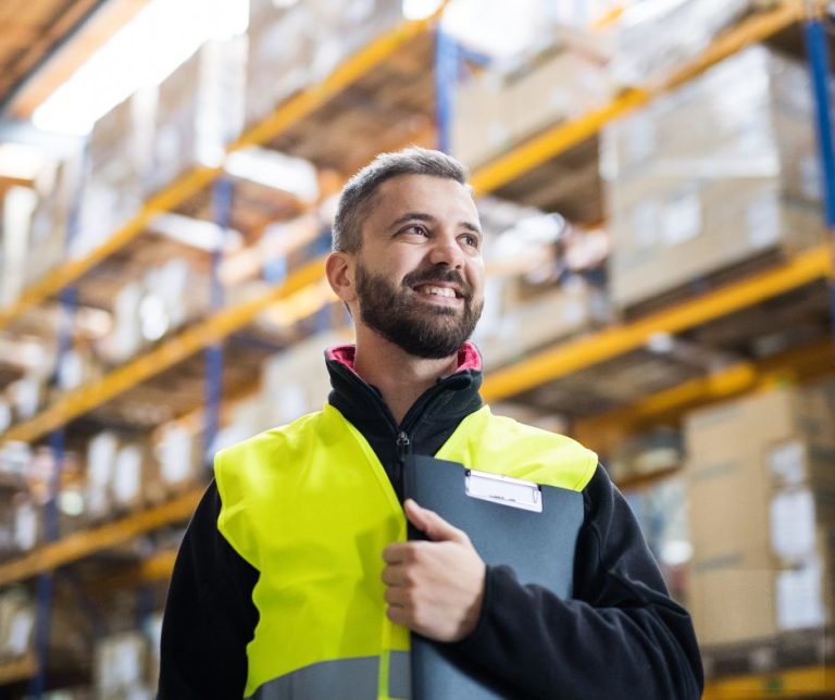 Man surveying a commercial warehouse for air con installation